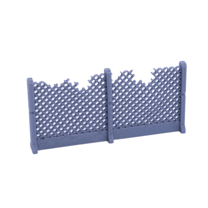 Damaged wire mesh fence section with broken upper edges and industrial support posts