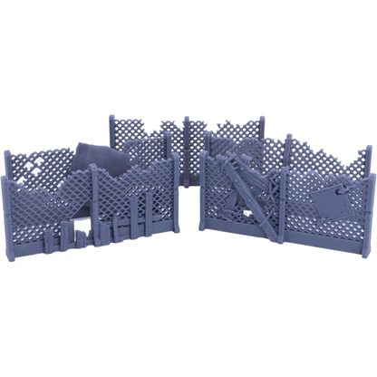 Collection of broken wire mesh fence terrain featuring boards, scrap metal, and damaged panels