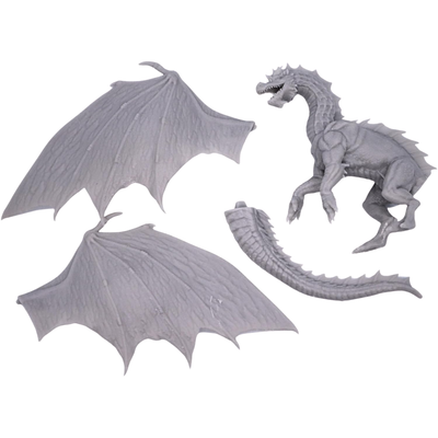 Unpainted Young Green Dragon miniature components showing separate dragon body, tail, and large wing pieces prior to assembly.