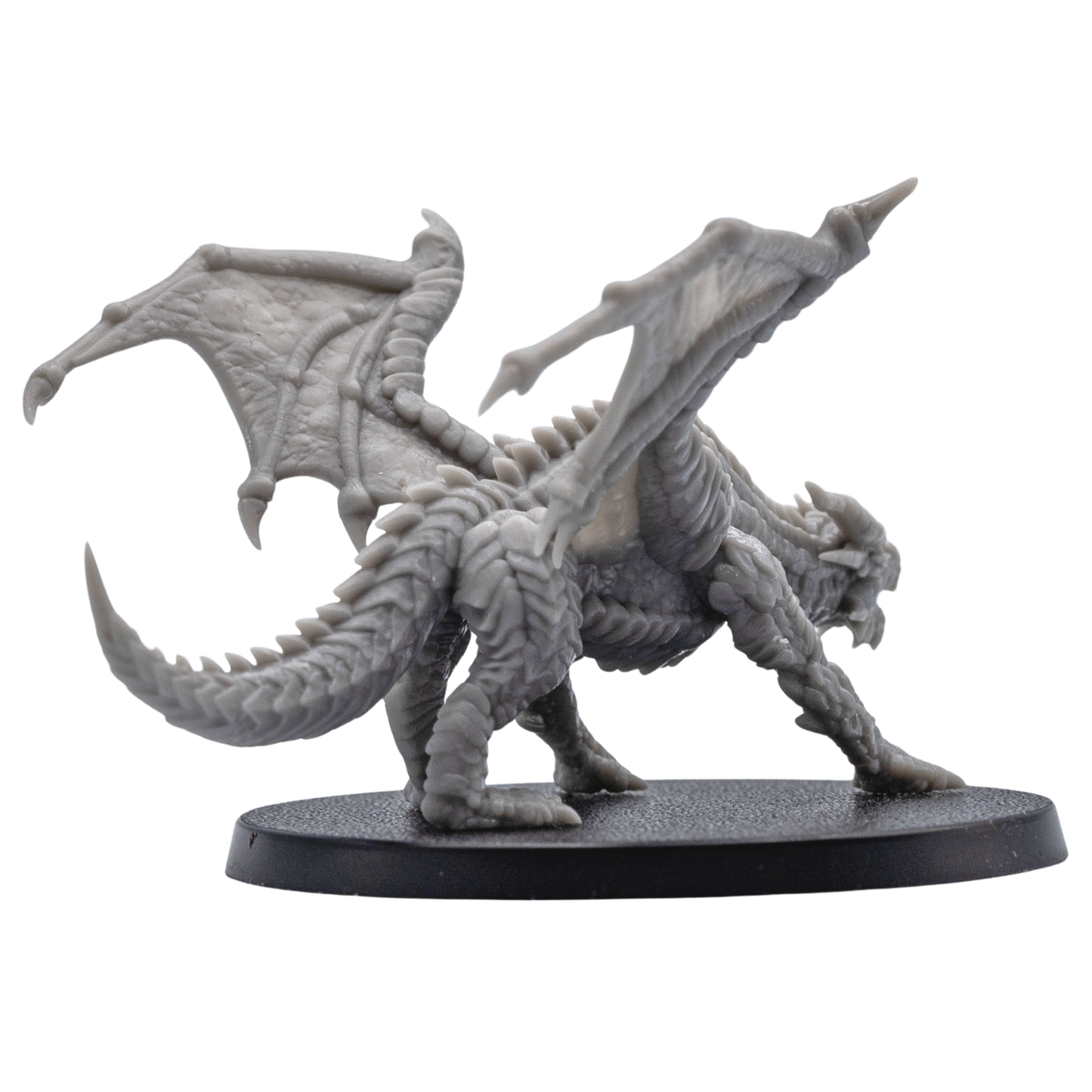 Back angle view of the Young Red Dragon resin miniature showing wing membranes, spine detail, tail, and textured base.