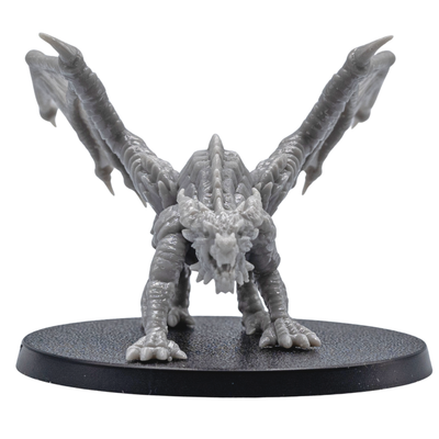 Front view of an unpainted Young Red Dragon resin miniature with open wings, sharp claws, detailed horns, and aggressive pose.