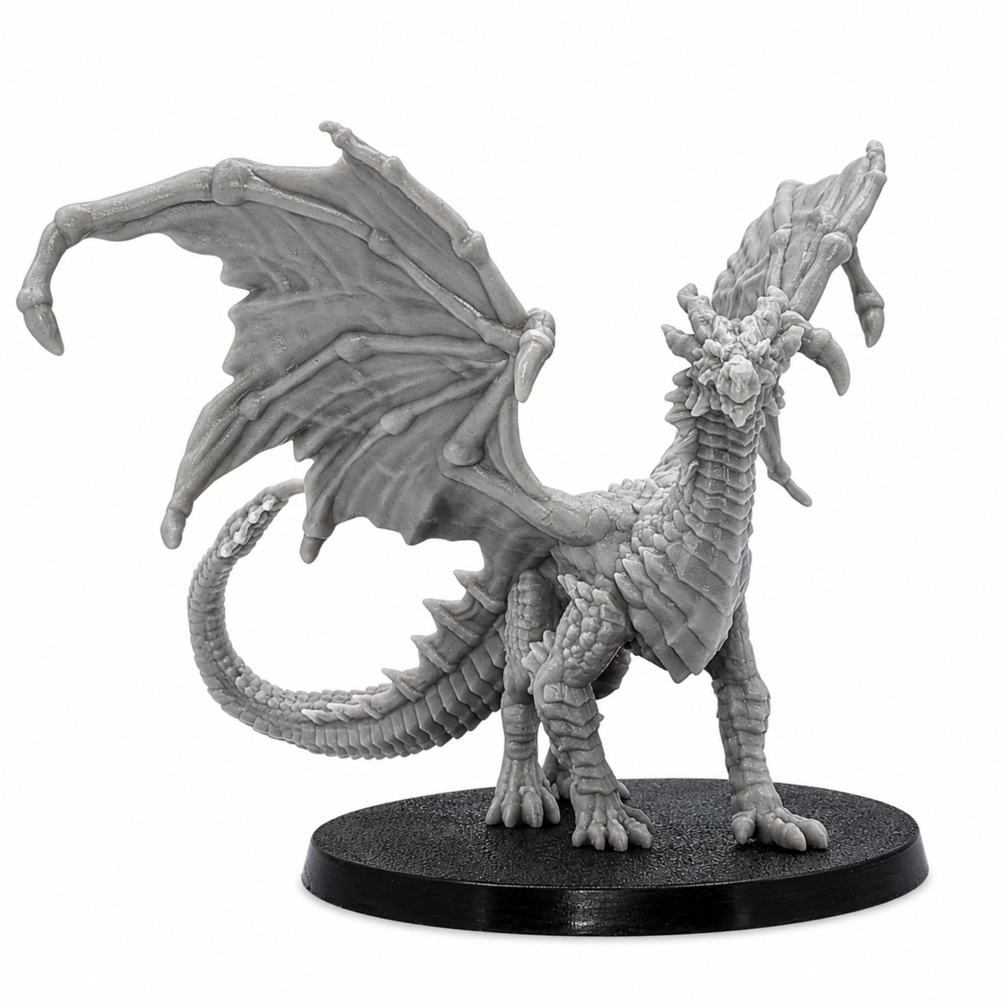 Front view of an unpainted Young Yellow Dragon miniature with open wings, detailed horns, scales, claws, and long tail.