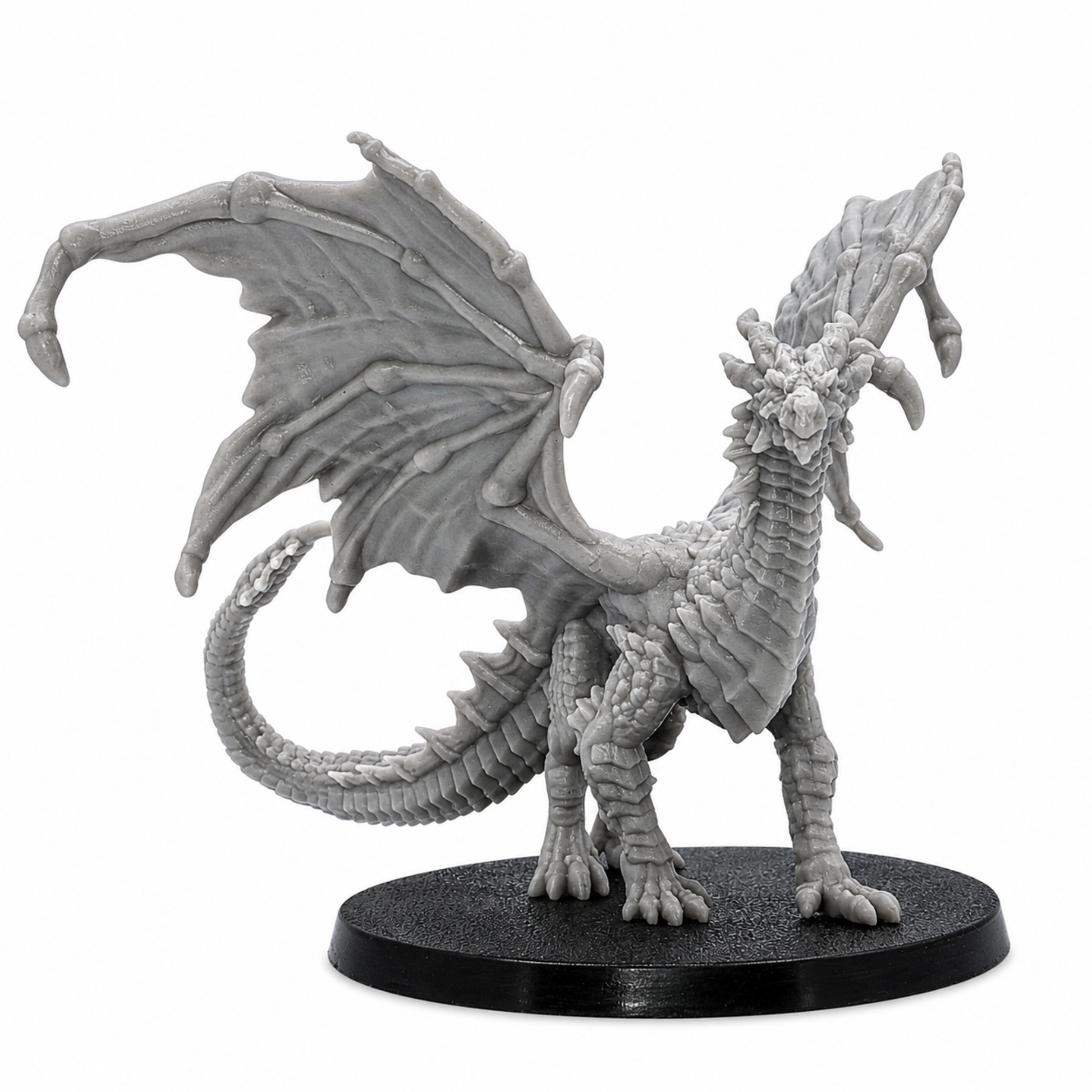 Front view of an unpainted Young Yellow Dragon miniature with open wings, detailed horns, scales, claws, and long tail.