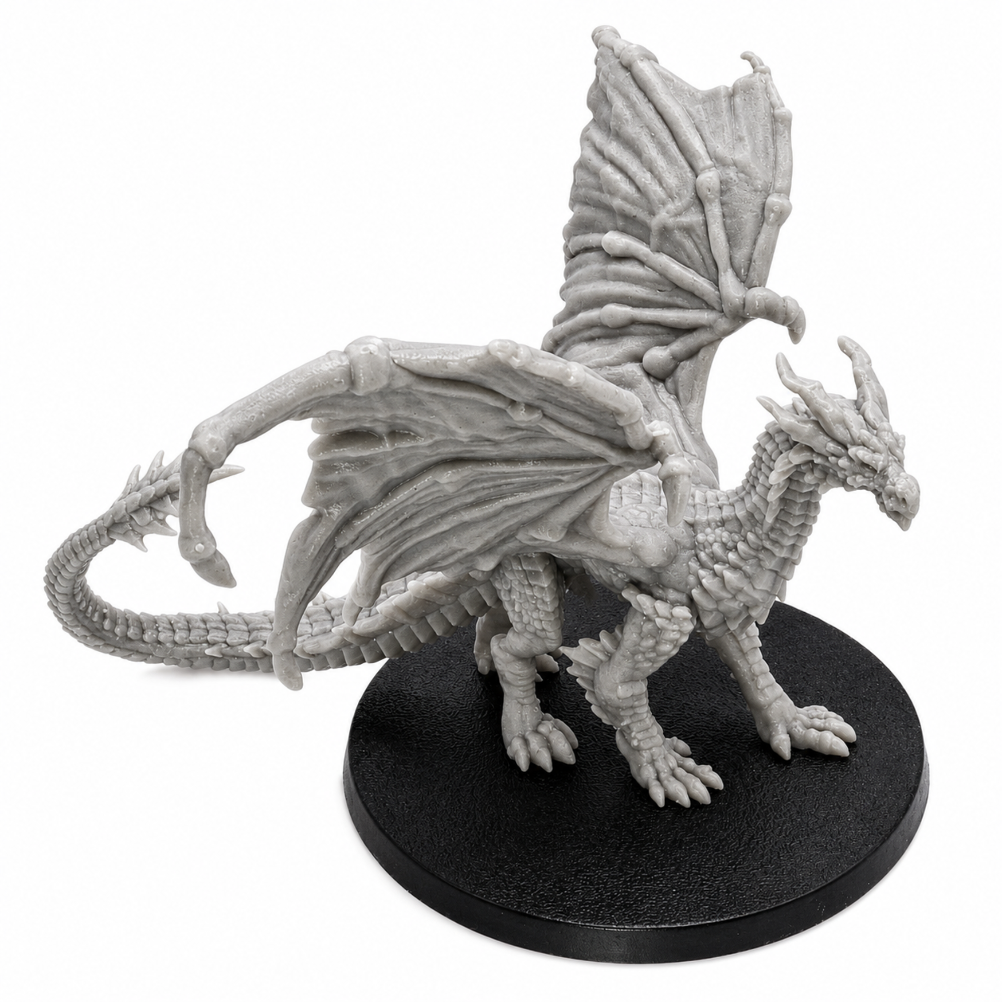 Profile view of an unpainted Young Yellow Dragon fantasy miniature by Epic Miniatures with raised wings and detailed scales.