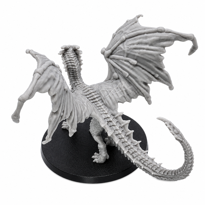 Top rear view of the Young Yellow Dragon miniature showing detailed wings, spine, tail, and resin sculpt texture.