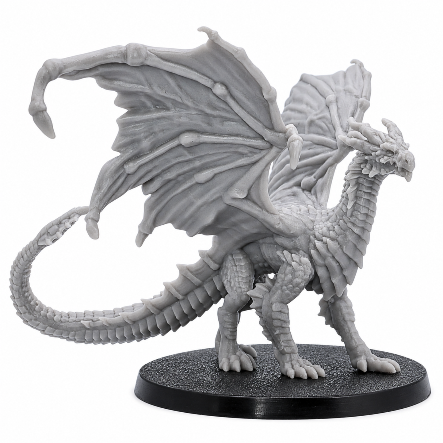 Side view of an unpainted Young Yellow Dragon resin miniature by Epic Miniatures showing wings, scales, tail, and 60mm base.
