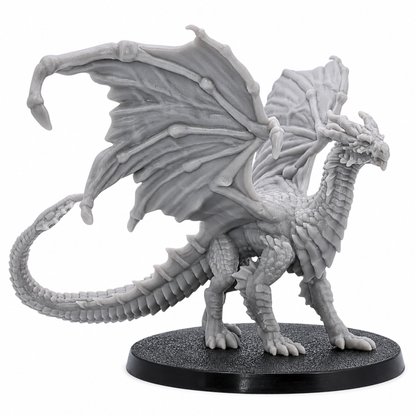 Side view of an unpainted Young Yellow Dragon resin miniature by Epic Miniatures showing wings, scales, tail, and 60mm base.